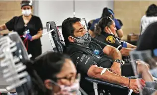  ?? Bob Owen / Staff file photo ?? Jerry Gallegos gives blood during a South Texas Blood and Tissue Center drive in May. The blood bank has been struggling to maintain an adequate supply of blood since the pandemic’s onset.