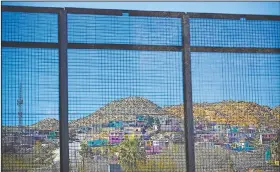  ?? AP/PABLO MARTINEZ MONSIVAIS ?? Homes in Ciudad Juarez, Mexico, are seen Saturday from the other side of the border fence in El Paso, Texas.