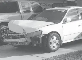  ?? Ken Ritter ?? The Associated Press A 2002 Honda Accord involved in a March 3 crash sits in a driveway in Las Vegas on April 18. An exploding Takata air bag inflator badly injured the driver, Karina Dorado.