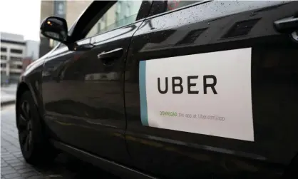  ?? Photograph: Matthew Horwood/Getty Images ?? Uber UK has had to accept that workers are entitled to the minimum wage and holiday pay.