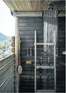  ??  ?? Samantha and William have stocked their outdoor shower with products from Africology. A low-voltage marine pump allows for greater water pressure from the oversized shower head.