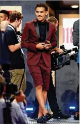  ?? GETTY IMAGES ?? New Hawks guard Trae Young prizes being different — and his fashion choice at the NBA draft last month screamed it. “Be Different” was written on the side of one shoe.