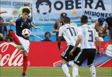  ?? (Photos AFP/EPA) ?? Benjamin Pavard se rappellera à vie de ce France-Argentine .