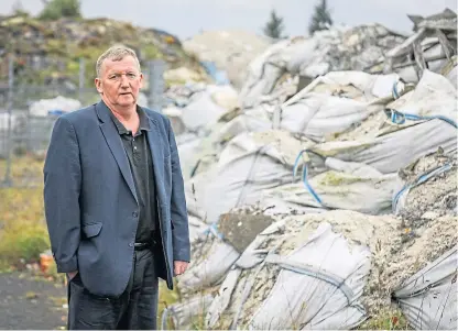  ?? Picture: Kris Miller. ?? MSP Alex Rowley beside some of the waste dumped at the M90 Commerce Park.