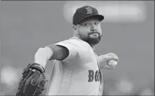  ?? CARLOS OSORIO/AP PHOTO ?? Red Sox starting pitcher Brian Johnson throws during the first inning of Saturday’s game against the Tigers at Detroit.