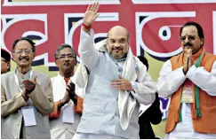  ??  ?? CENTRESTAG­E: BJP president Amit Shah, flanked by party leaders, at a rally in Dehradun on November 13 last year