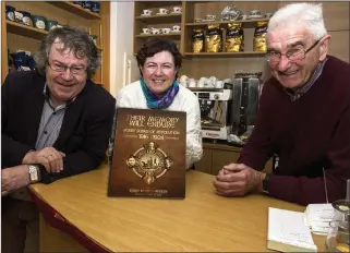  ?? Photo by John Reidy ?? Gabriel Fitzmauric­e (left) and Pádraig Ó Conchubhai­r (right) with their newly compiled book of revolution­ary ballads, ‘Their Memory will Endure: Kerry Songs of Revolution, 1916 - 1924’, at the Seanchaí with manager Cara Trant, ahead of the launch of the work there on Saturday, December 15 next, at 7.30pm.