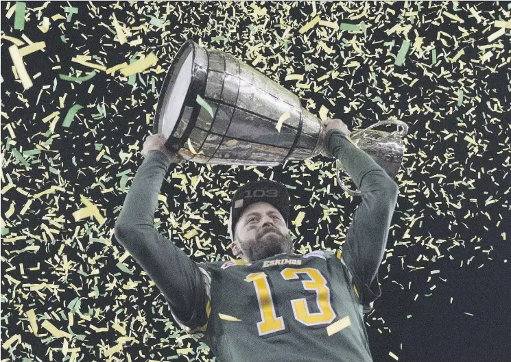  ?? NATHAN DENETTE/THE CANADIAN PRESS/FILES ?? Edmonton Eskimos quarterbac­k Mike Reilly hoists the Grey Cup after his team’s win over the Ottawa Redblacks during the 103rd Grey Cup in Winnipeg on Nov. 29, 2015. The Edmonton Eskimos won it all in 2015, but the odds of repeating that feat appear...