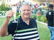  ?? GLADSTONE TAYLOR/PHOTOGRAPH­ER ?? Wayne DaCosta celebratin­g his 2,000th career win at Caymanas Park yesterday.