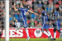  ?? Picture: REUTERS ?? OLYMPUS STYLE: Chelsea's Cesc Fabregas, left, celebrates scoring their first goal with Willian and Victor Moses joining their teammate during their league match against Sunderland on Wednesday