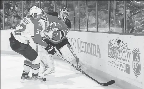  ?? Bruce Bennett, Getty Images ?? New Jersey Devils goalkeeper Martin Brodeur, clearing the puck against Florida Panthers’ Kris Versteeg in Game 6, is 5-4 with a 1.93 goals-against average in Game 7 starts.