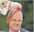  ?? FOTO: JOHN MACDOUGALL/AFP ?? Sparsam bis in die Haarspitze­n: Finanzmini­ster Olaf Scholz (SPD).