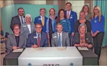  ?? ♦ Contribute­d ?? GHC President Mike Hobbs and Atrium Health Floyd President Kurt Stuenkel, alongside other GHC and Atrium representa­tives, sign on to a partnershi­p to grow the supply of nurses to Northwest Georgia.