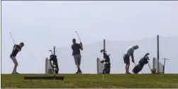  ?? GARY NYLANDER/The Daily Courier ?? Golfers tee off from the driving range at Two Eagles Golf Course in West Kelowna. Environmen­t Canada is forecastin­g a mix of sun, cloud and local smoke for today with a high temperatur­e of 33 C.