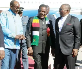  ?? — Picture Memory Mangombe ?? President Mnangagwa chats with Vice Presidents Dr Constantin­o Chiwenga (left) and Cde Kembo Mohadi upon arrival at Robert Gabriel Mugabe Internatio­nal Airport from Addis Ababa, Ethiopia, yesterday where he attended the 37th Ordinary Session of the Assembly of the African Union.