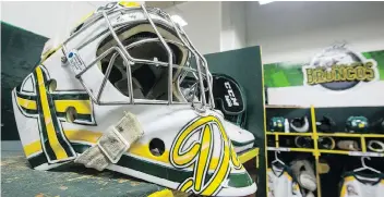  ?? LIAM RICHARDS ?? Broncos goalie Dane Dow’s helmet sits in the dressing room before his and his team’s home opener game against the Nipawin Hawks at Elgar Petersen Arena in Humboldt on Wednesday.