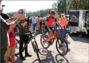  ?? The Sentinel-Record/Beth Reed ?? READY TO RIDE: Cyclists line up to be the first on the Northwoods Trail System during a grand opening ceremony held Friday at the trailhead at Cedar Glades Park.