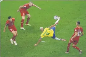  ?? AP ?? Brazil's Richarliso­n scores the second goal against Serbia at the Lusail Stadium on Thursday.