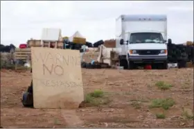  ?? JESSE MOYA — THE TAOS NEWS VIA AP ?? This photo shows a “no trespassin­g” sign outside the location where people camped near Amalia, N.M. Three women believed to be the mothers of 11 children found hungry and living in a filthy makeshift compound in rural northern New Mexico have been...