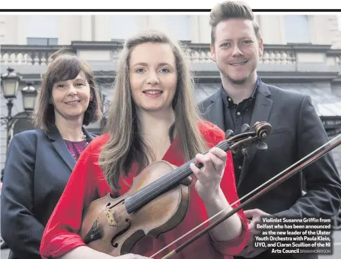  ??  ?? Violinist Susanna Griffin from Belfast who has been announced
as the new leader of the Ulster Youth Orchestra with Paula Klein, UYO, and Ciaran Scullion of the NI
Arts Council