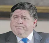  ?? JUSTIN L. FOWLER/THE STATE JOURNAL-REGISTER VIA AP/POOL, FILE PHOTO ?? Gov. J.B. Pritzker said all four state regions in his reopening plan are set to see further restrictio­ns lifted come Friday.