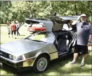  ??  ?? David March of Boyertown with his 1981DMC-12DeLorean of Berks County. March, a retired entreprene­ur, is using the DeLlorean to help promote local businesses.