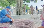  ?? HT PHOTO ?? A health department employee waits as activists of a farmer union did not allow his team to enter the village in Patiala.