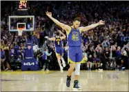  ?? CARLOS AVILA GONZALEZ — SAN FRANCISCO CHRONICLE VIA AP ?? Golden State Warriors’ Stephen Curry (30) celebrates a 3-pointer by Klay Thompson’s against the Memphis Grizzles during the second half in Game 6of the Western Conference semifinals of the NBA basketball playoffs in San Francisco on Friday, May 13, 2022. The Warriors defeated the Grizzlies 110-96 to advance to the conference finals.