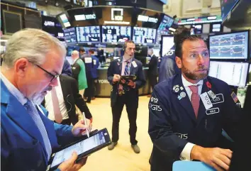  ?? Reuters ?? Traders at the New York Stock Exchange yesterday. Investors are likely to see the potential for further depreciati­on in EM currencies after President Donald Trump’s latest remarks.