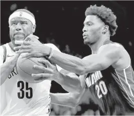  ?? GETTY IMAGES FILE ?? “He’s a true two-way basketball player,” Heat head coach Erik Spoelstra says of Justise Winslow, right.