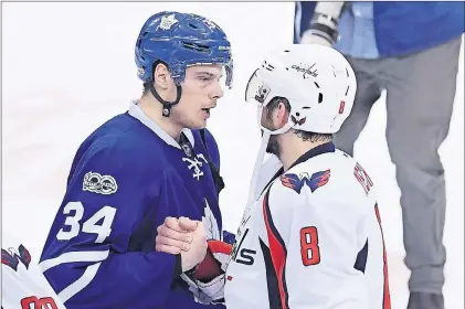  ?? Cp photo ?? Toronto Maple Leafs centre Auston Matthews (left) and Washington Capitals left wing Alex Ovechkin shake hands after the Washington Capitals defeated the Toronto Maple Leafs during the first overtime period of Game 6 in an NHL Stanley Cup first-round playoff series in Toronto on Sunday.