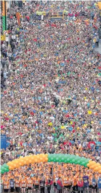  ??  ?? Runners line up at the start of the Great Manchester Run