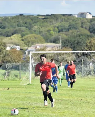  ??  ?? Wales rugby star Gavin Henson playing football for his new club, Super Fox FC