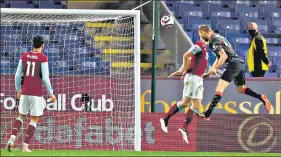  ?? AFP ?? Nathaniel Phillips (R) scores Liverpool’s second goal versus Burnley at Turf Moor on Wednesday.