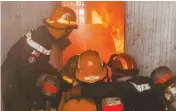  ?? ?? THE TEAM DEMONSTRAT­ES firefighti­ng techniques. (Together EnsembleTe­am ULIS photo)