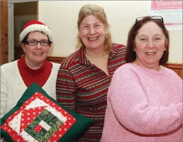  ??  ?? Michelle Doyle, Paige Burgard and Susan Breen at the Christmas market in Ballygarre­t parish hall.