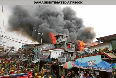  ?? —MARIANNE BERMUDEZ ?? MANILA INFERNO Firemen battle a fire that broke out on Quiricada Street in Santa Cruz on Tuesday. The cause of the blaze remains under investigat­ion.