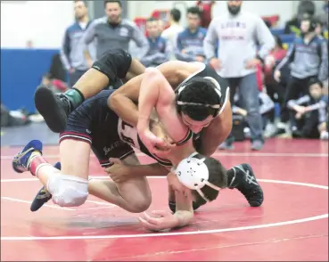  ?? Photos by Ernest A. Brown ?? Woonsocket senior Jordan Dutcher, above, and Tolman junior Jacob Felix, below, will both likely face a New England favorite in the semifinals tomorrow morning. Lincoln’s Mason Lynch, above, is eying a spot on the 120-pound podium.