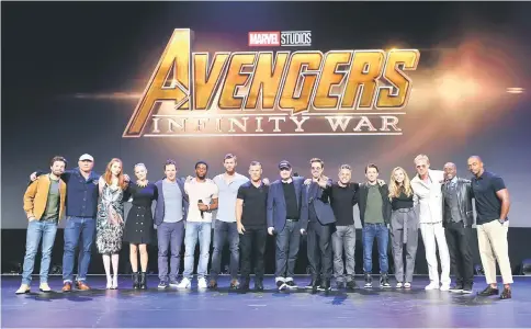  ?? — AFP photo ?? (Left to right) Actors Sebastian Stan, Dave Bautista, Karen Gillan, Pom Klementief­f, Benedict Cumberbatc­h, Chadwick Boseman, Josh Brolin, and Chris Hemsworth, producer Kevin Feige, and actors Robert Downey Jr, Mark Ruffalo, Tom Holland, Elizabeth...