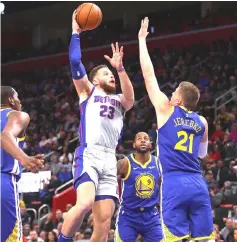  ??  ?? Blake Griffin (second left) of the Detroit Pistons takes a shot over Jonas Jerebko (right) of the Golden State Warriors during the second half at Little Caesars Arena in Detroit, Michigan. — AFP Photo