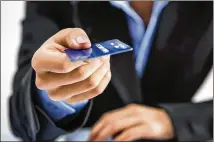  ?? FOTOLIA / TNS ?? A growing number of Americans say they whip out a credit or debit card even when spending less than $5, according to a CreditCard­s. com survey of 616 people with major credit cards.