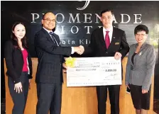  ??  ?? (L to R) Ms Jesica Chong (Promenade's marketing communicat­ions manager), Dr Jamaluddin Bin Mohd Ali, Hafizan Wong and Ms Anita Chung (Promenade's group director of sales & marketing) at the cheque presentati­on.