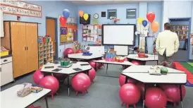  ?? COURTESY OF FIESTA BOWL ?? Marissa Chavez used her grant money to create a lending library for her kindergart­en classroom.