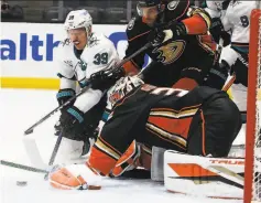  ?? Ringo H.W. Chiu / Associated Press ?? Ducks goalie John Gibson protects the net against Sharks forward Logan Couture (39) in the first period of a 60 San Jose victory.