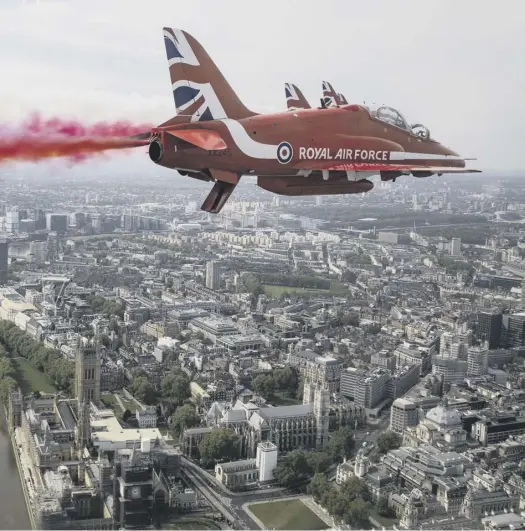  ??  ?? of Parliament in London during a flypast to mark the 75th anniversar­y of VE Day