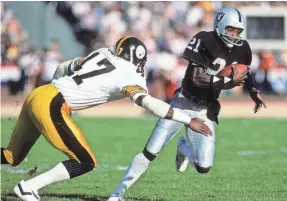  ?? GEORGE ROSE/GETTY IMAGES ?? Cliff Branch runs the ball for the Raiders against Mel Blount of the Steelers in a January 1984 playoff game.