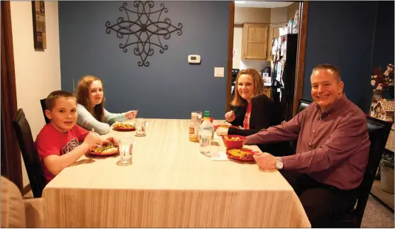  ?? Donnis Hueftle-Bullock ?? Family dining is important at the Fessler home. Pictured above from left, are Sid Fessler III, Quin Fessler, Heidi Fessler and Sid Fessler II.