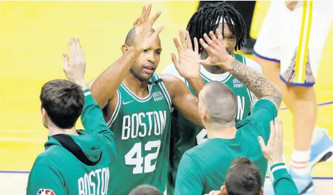  ?? ?? Boston Celtics centre Al Horford (42) celebrates with teammates during the second half of Game One of basketball’s NBA Finals against the Golden State Warriors in San Francisco on Thursday.