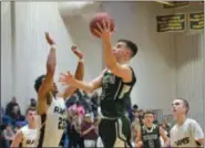  ?? THOMAS NASH - DIGITAL FIRST MEDIA ?? Above, Spring-Ford’s Marcus Girardo (5) rises up for a basket while Spring-Ford’s Noah Baker (23) defends. Below, Spring-Ford’s Robert Bobeck (44) rises up for a shot while Methacton’s Jeff Woodward defends.