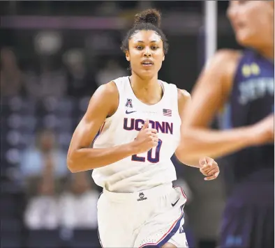  ?? Jessica Hill / Associated Press ?? UConn’s Olivia NelsonOdod­a runs down court during an exhibition game on Sunday in Storrs.